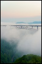 New River Gorge Bridge emerging from fog at dawn. New River Gorge National Park and Preserve ( color)