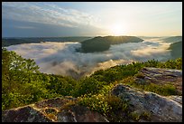 Sun rising over fog-filled gorge bend from Grandview Overlook. New River Gorge National Park and Preserve ( color)