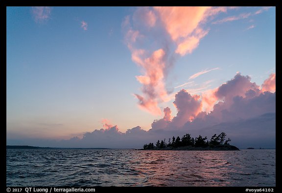 Islet and clouds at sunset, Rainy Lake. Voyageurs National Park, Minnesota, USA.