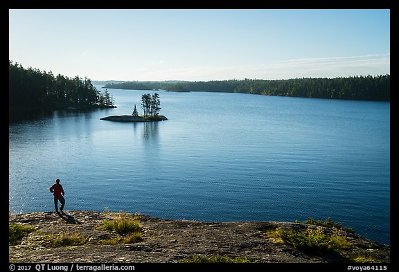Visitor looking, Anderson Bay and Rainy Lake. Voyageurs National Park, Minnesota, USA.