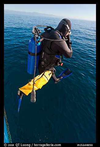 Scuba diver jumping from boat. Channel Islands National Park (color)