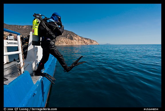 Scuba diver stepping out of boat, Santa Cruz Island. Channel Islands National Park (color)