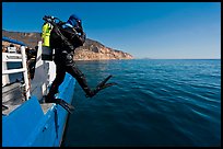 Scuba diver stepping out of boat, Santa Cruz Island. Channel Islands National Park ( color)