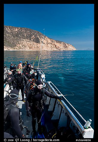 Divers in full wetsuits on diving boat, Santa Cruz Island. Channel Islands National Park (color)