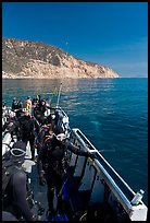Divers in full wetsuits on diving boat, Santa Cruz Island. Channel Islands National Park ( color)