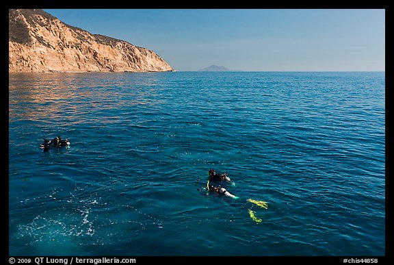 Scuba divers on ocean surface, Santa Cruz Island. Channel Islands National Park (color)