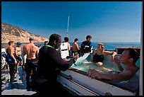 Divers in hot tub aboard the Spectre dive boat, Santa Cruz Island. Channel Islands National Park ( color)
