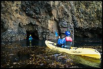 Kayakers entering sea cave, Santa Cruz Island. Channel Islands National Park ( color)