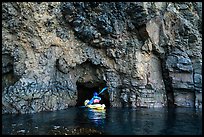 Kayaker entering narrow sea cave, Santa Cruz Island. Channel Islands National Park ( color)
