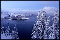 Wizard Island and Lake at dusk in winter. Crater Lake National Park, Oregon, USA.