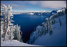Snow-covered trees and dark lake waters. Crater Lake National Park ( color)