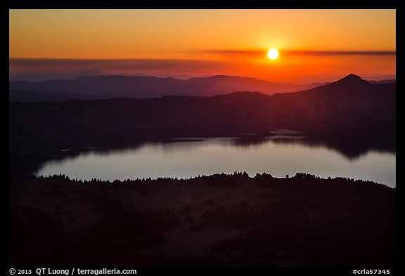 Crater Lake with setting sun from Mount Scott. Crater Lake National Park, Oregon, USA.