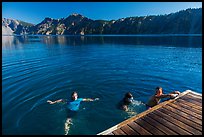 Girls swim from Wizard Island dock. Crater Lake National Park ( color)