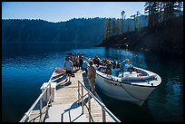 Visitors embark on tour boat at Wizard Island boat dock. Crater Lake National Park ( color)