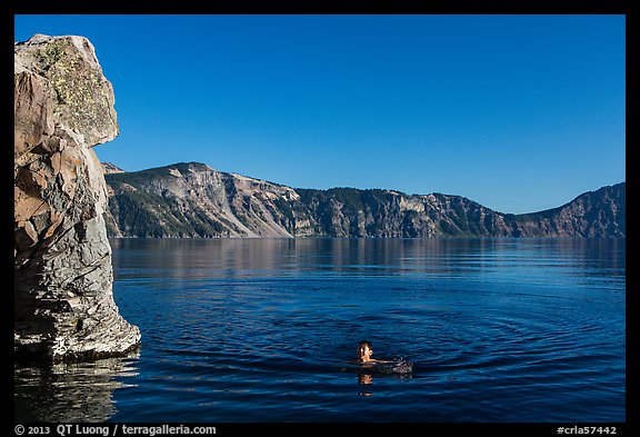 Man swimming in lake, Cleetwood Cove. Crater Lake National Park, Oregon, USA.