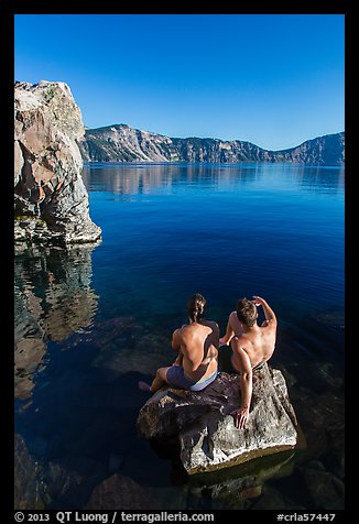 Men sunning on rock, Cleetwood Cove. Crater Lake National Park (color)