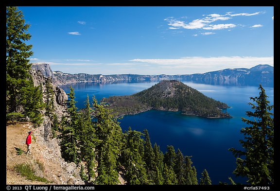 Visitor looking, Wizard Island and lake. Crater Lake National Park (color)