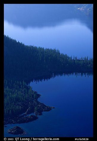 Wizard Island and crater rim reflection, early morning. Crater Lake National Park (color)