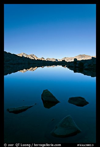 Rocks and calm lake with mountain reflections, early morning, Dusy Basin. Kings Canyon National Park (color)