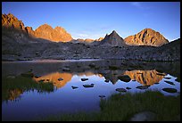Mt Thunderbolt, Isoceles Peak, and Palissades reflected in a lake in Dusy Basin, sunset. Kings Canyon National Park, California, USA.