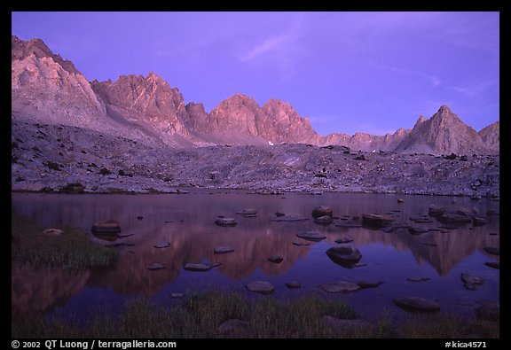Mt Agasiz, Mt Thunderbolt, and Isoceles Peak reflected in a lake in Dusy Basin, sunset. Kings Canyon  National Park, California, USA.