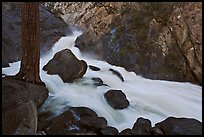 Forceful waterfall rushing through narrow granite chute. Kings Canyon National Park ( color)