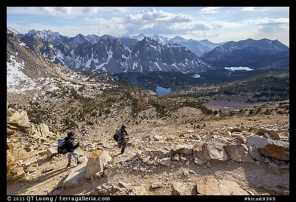 Women hikers descend trail from Kearsarge Pass. Kings Canyon National Park, California, USA.