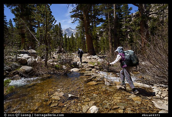 Hikers crossing a stream near Bubbs Creek, Kings Canyon National Park. California (color)