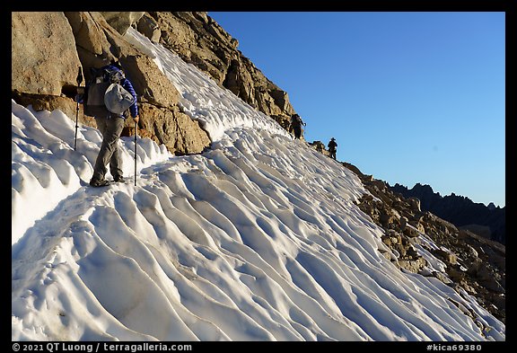 Hikers traversing a steep snowfield below Forester Pass, Kings Canyon National Park. California (color)