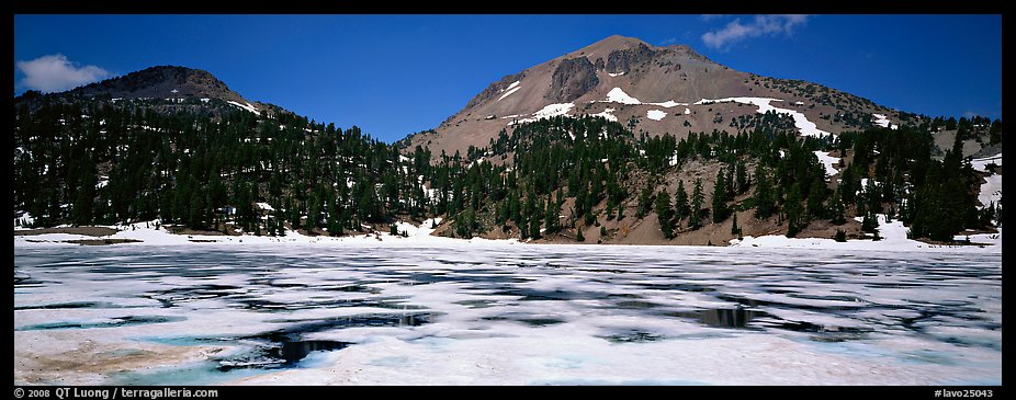 Melting ice in lake and Lassen Peak. Lassen Volcanic National Park, California, USA.