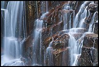 Waterfall over columns of cooled lava. Mount Rainier National Park, Washington, USA. (color)