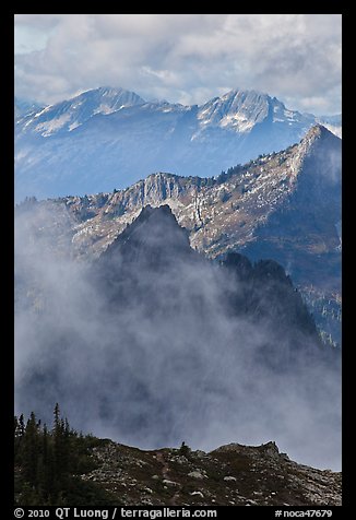 Peaks partly obscured by clouds, North Cascades National Park. Washington, USA.