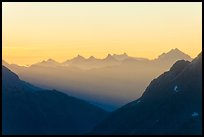 First sunrays lighting peaks above Cascade Pass, North Cascades National Park. Washington, USA. (color)