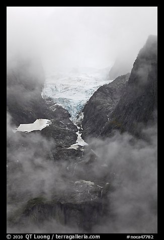 Hanging glacier in fog, North Cascades National Park. Washington, USA.