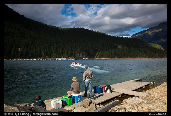 Guests waiting for ride across lake to Ross Lake resort, North Cascades National Park Service Complex.  (color)