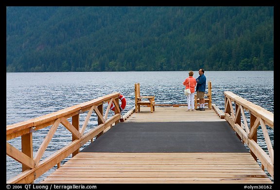 Couple on Pier, Crescent Lake. Olympic National Park, Washington, USA.