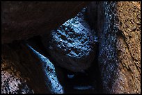 Dark passage with wedged boulder, Balconies Cave. Pinnacles National Park, California, USA. (color)