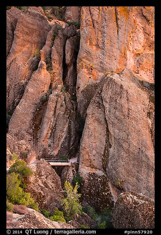 Footbridge at Tunnel exit dwarfed by rock towers. Pinnacles National Park, California, USA.