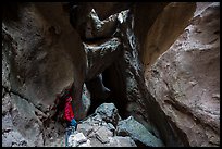 Hiker looking from staircase down into Lower Bear Gulch Cave. Pinnacles National Park ( color)
