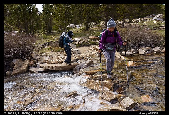 Hikers walk across Tyndall Creek, Sequoia National Park. California (color)