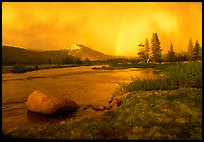 Tuolumne Meadows, Lembert Dome, and rainbow, storm clearing at sunset. Yosemite National Park, California, USA.