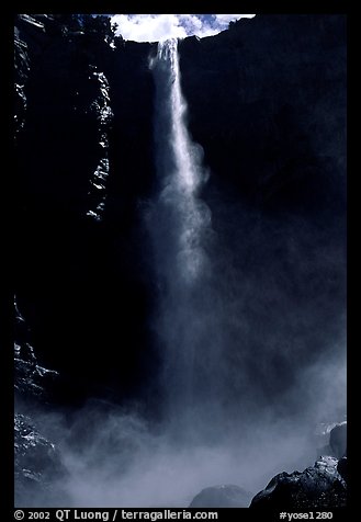 Bridalveil Falls as sun reaches upper shaft of water. Yosemite National Park, California, USA.