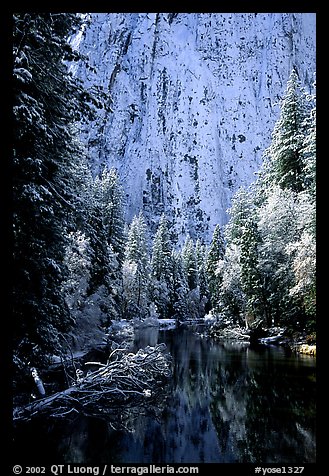 Cathedral rocks with fresh snow reflected in Merced River, early morning. Yosemite National Park, California, USA.