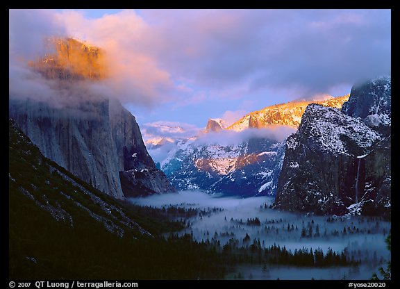 View with fog in valley and peaks lighted by sunset, winter. Yosemite National Park, California, USA.