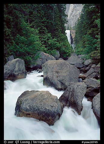 Boulders in frosty Merced River and distant Vernal Fall. Yosemite National Park (color)