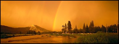 Evening storm with rainbow over Tuolumne Meadows. Yosemite National Park (Panoramic color)