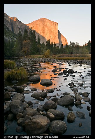 Boulders in Merced River and El Capitan at sunset. Yosemite National Park (color)
