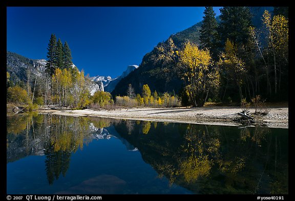 Banks of  Merced River with Half-Dome reflections in autumn. Yosemite National Park, California, USA.