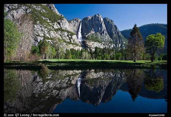 Yosemite Falls and meadow reflected in a seasonal pond. Yosemite National Park, California, USA.