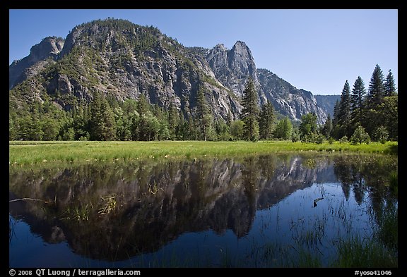 Sentinel Rock reflected in seasonal pond, Cook Meadow. Yosemite National Park, California, USA.
